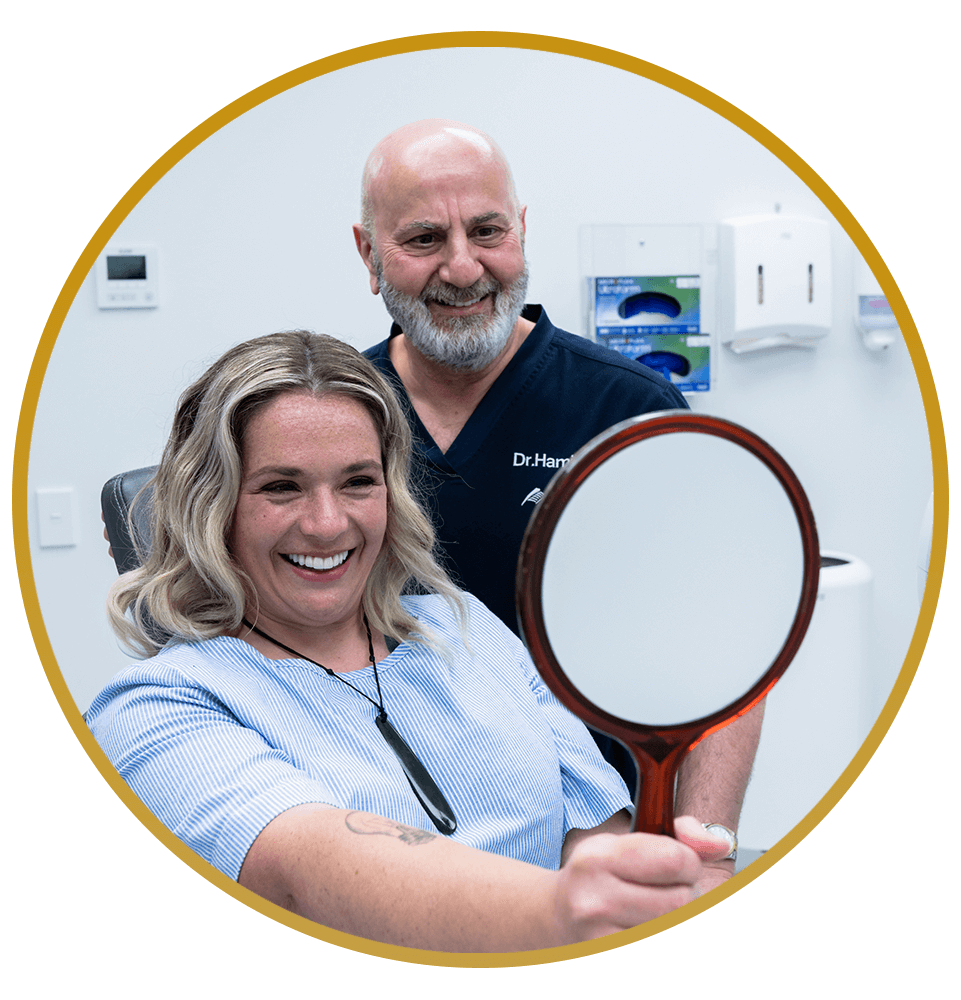 Dr. Hamid Al-Hassin showing patient new implants