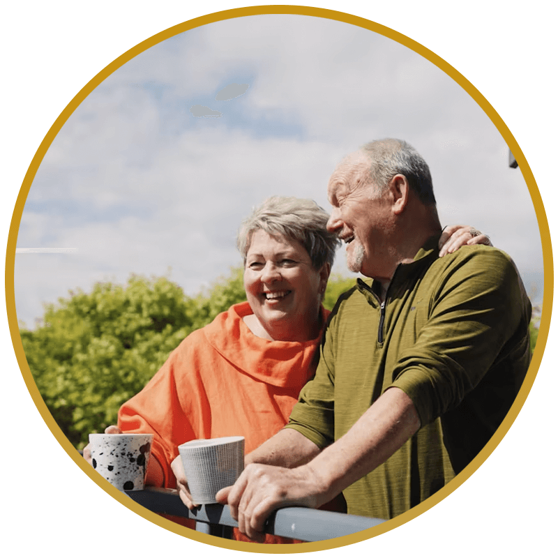 couple smiling together after All-On-X dental procedure