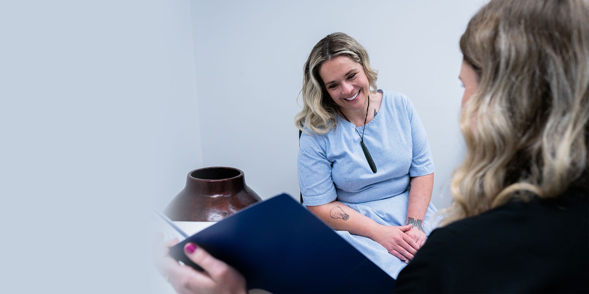 staff member going over finance paper with Patient