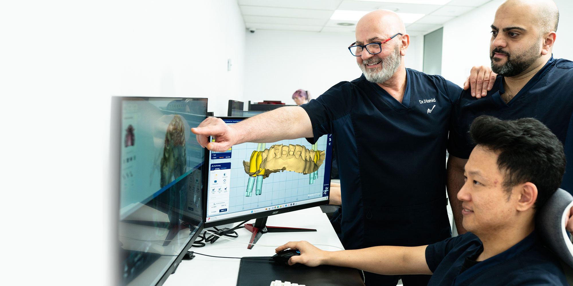 doctors going over x-ray of a patient's mouth