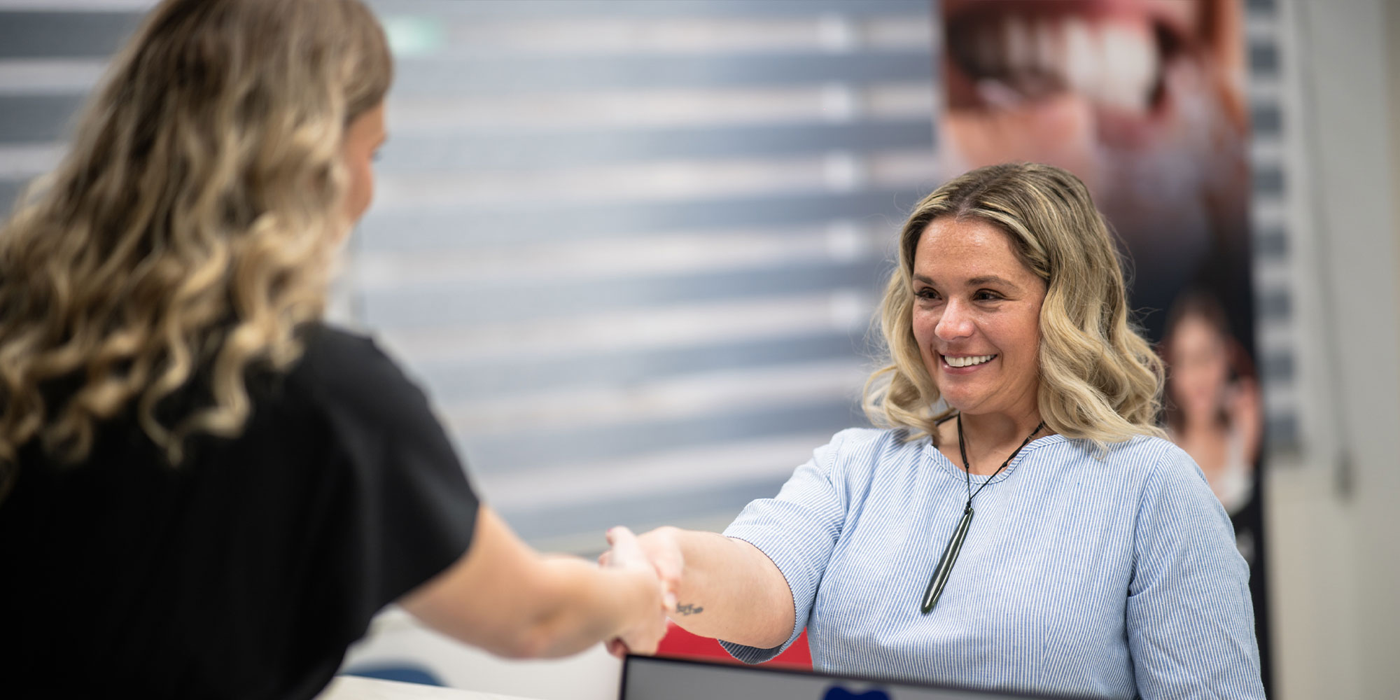 team member getting patient into Central Hutt Dental implant centre